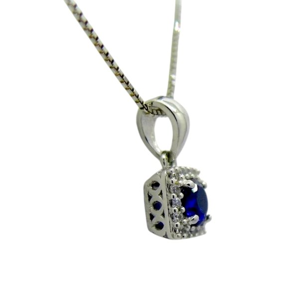 Collana ciondolo centro blu e contorno in oro 18 ct