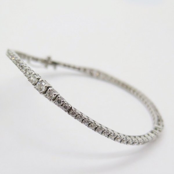 Bracciale tennis scalare in oro 18 ct